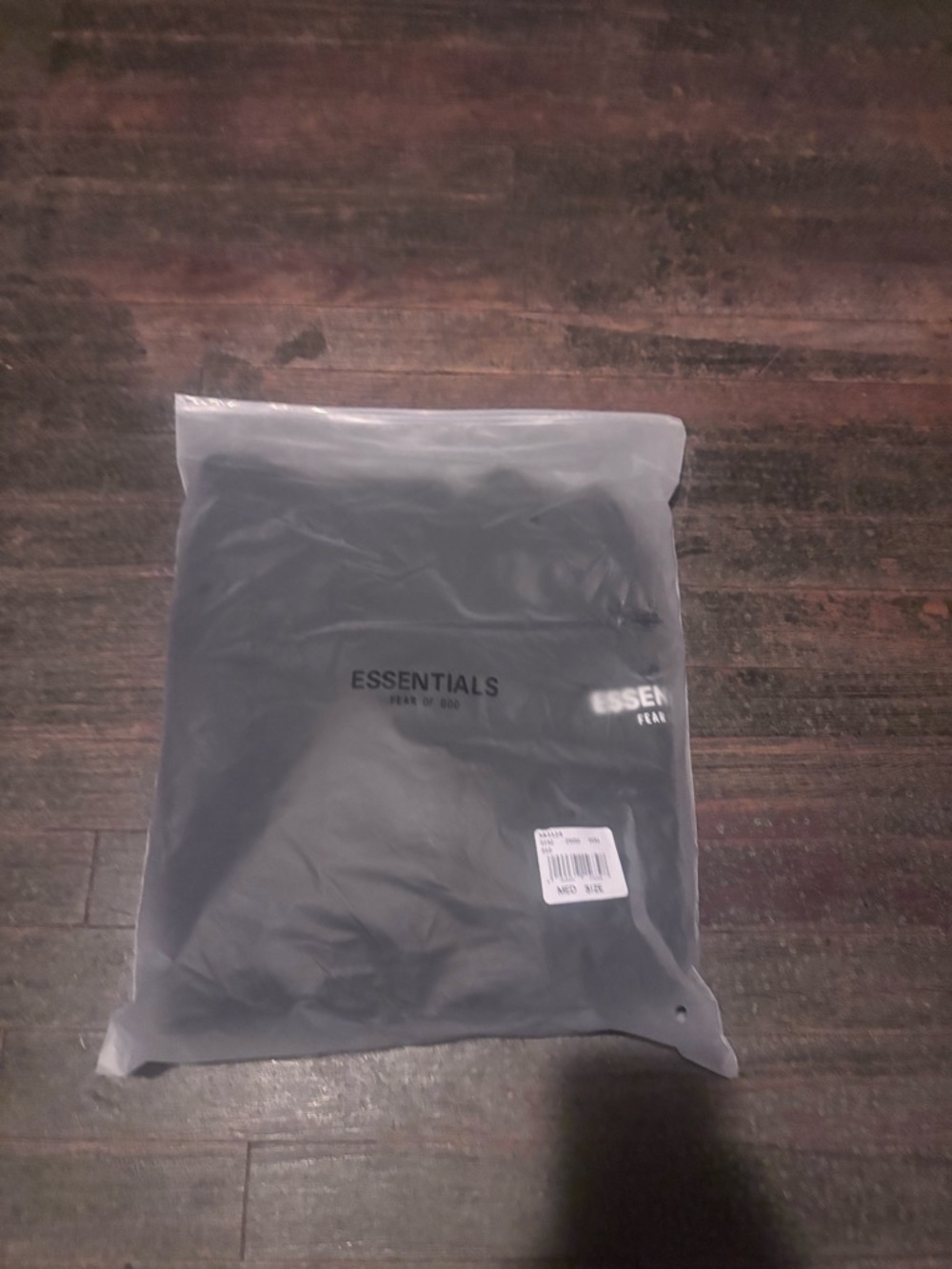 Essentials Black Logo Tee Packaged
